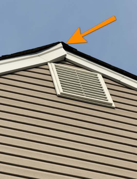 Roof rake edge metal flashing detaching from gable roof perimeter.
