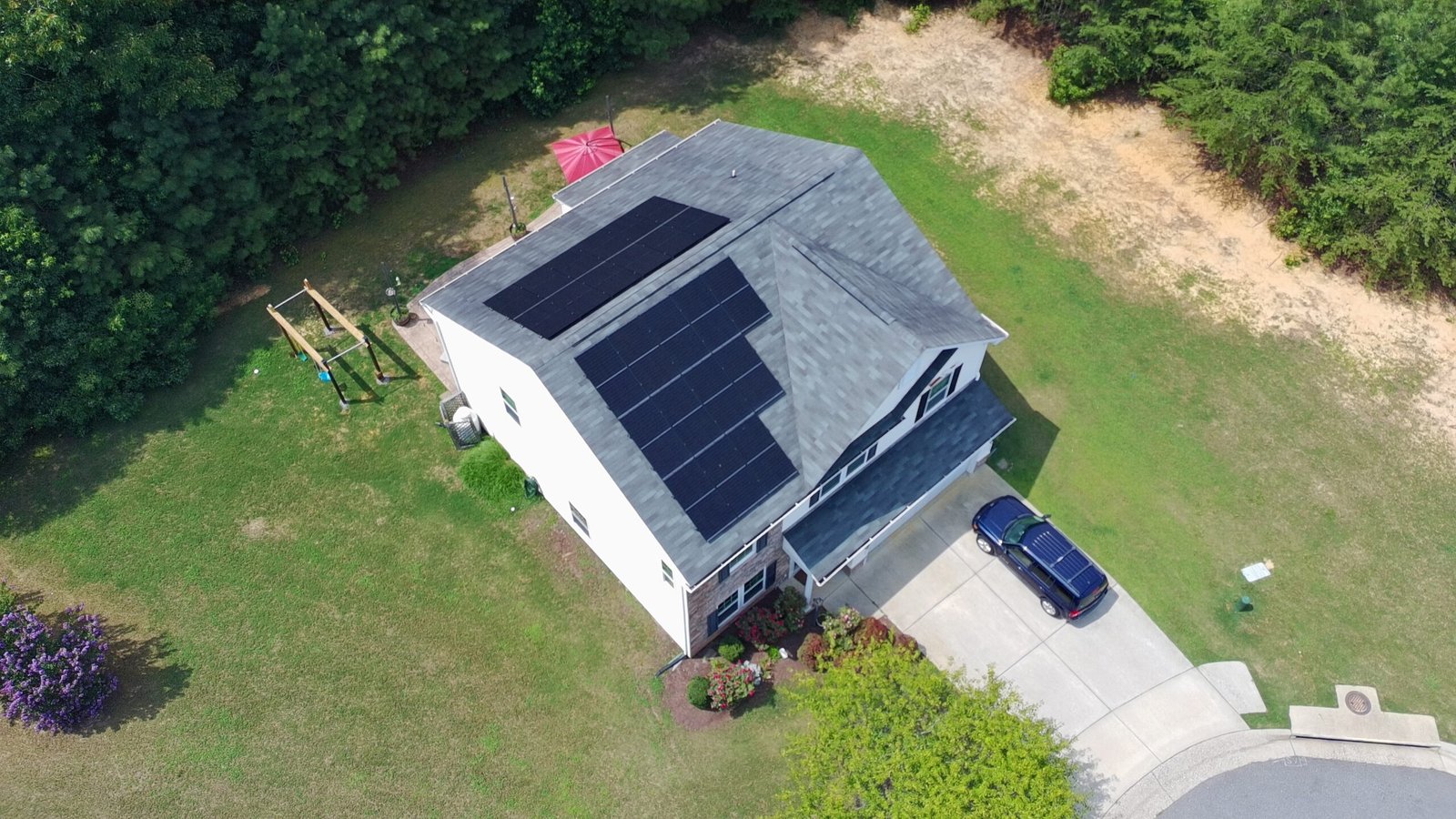 Elevated view looking down at residential roof structure.
