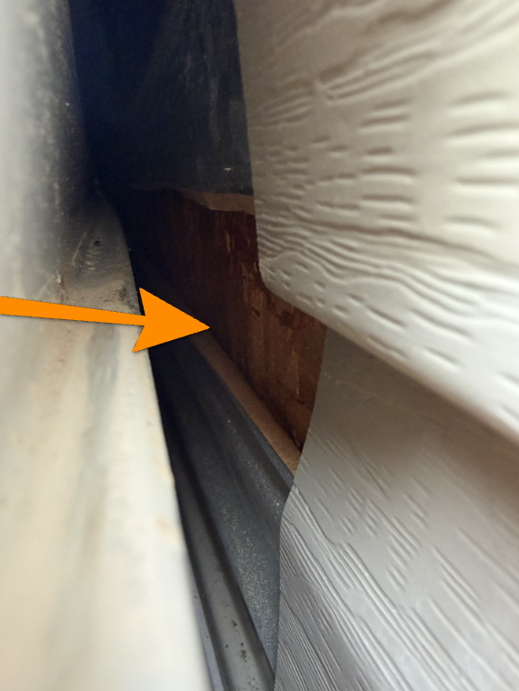 Exterior wall lacking house wrap water resistive barrier behind vinyl siding.