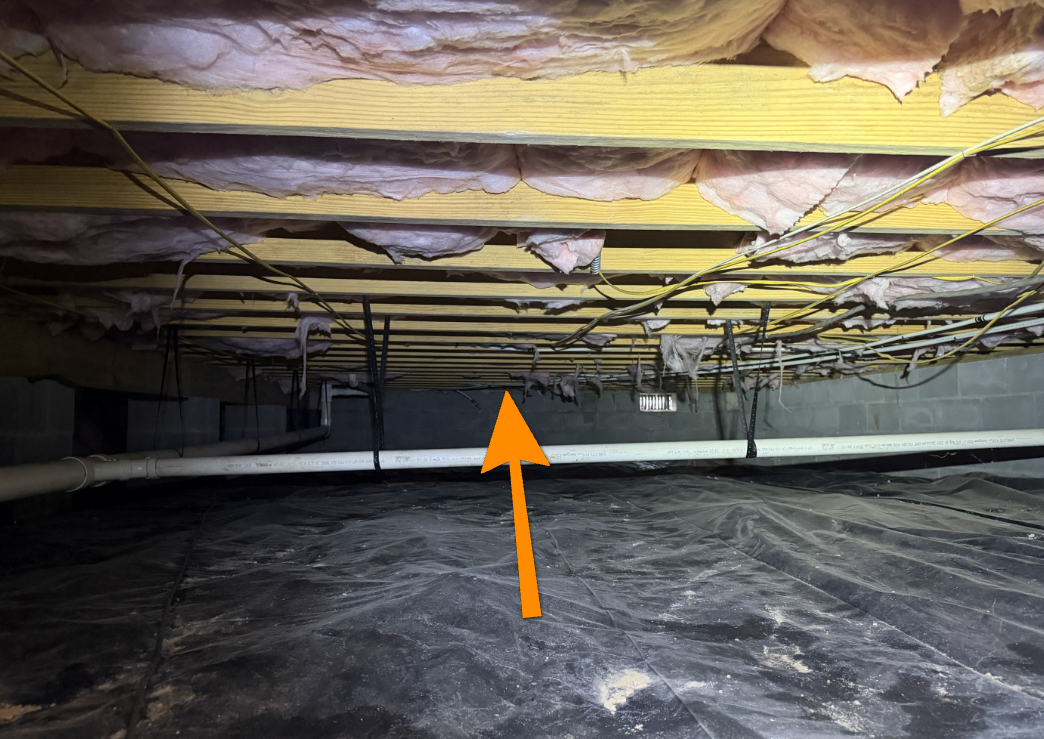 Floor joists spanning excessive distance without support.